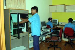 Student working with Swedish Braille Press Machine 