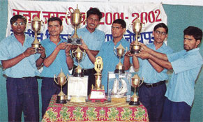 Students with winning trophies of national level competition